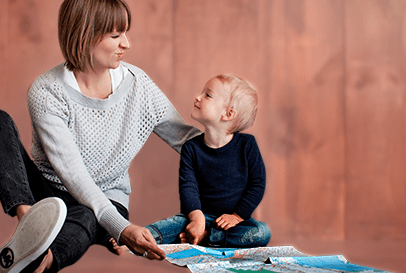 Image of a woman with a child looking at a map.