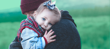 Image of a parent hugging a child.