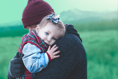 Image of a parent hugging a child.