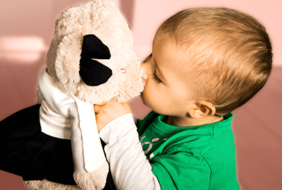 Kid playing with a stuffed bear toy