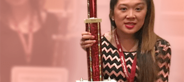 Julia holding her trophy