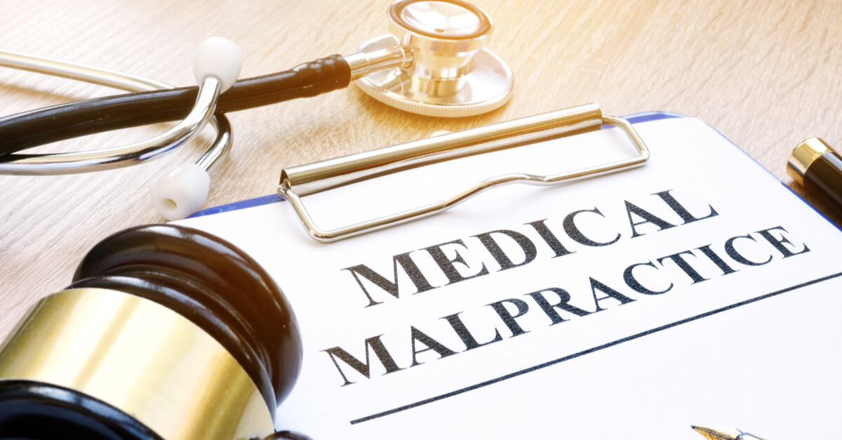 A piece of paper with the words medical malpractice on it