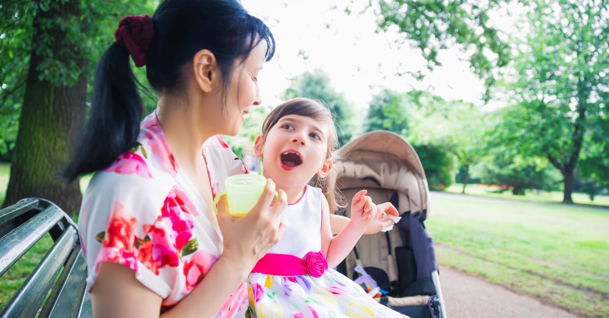 a mother holds her daughter, who has cerebral palsy