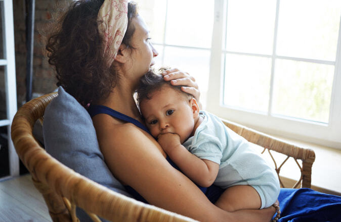 woman hugging baby