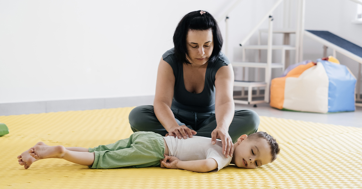 Child getting physical therapy to relieve cerebral palsy pain.