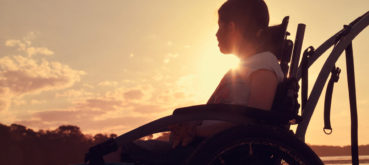 Girl sitting in wheelchair