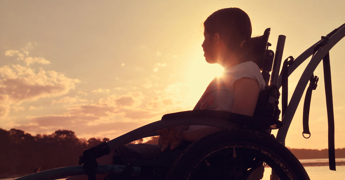 Girl sitting in wheelchair