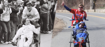 Dick Hoyt pushes son Rick in running wheelchair